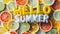 Lively Hello Summer letter balloons are nestled among a vibrant array of citrus slices, offering a zesty greeting