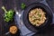 Liver stroganoff in black bowl, top view