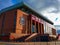 Liverpool, England, United Kingdom; 10/15/2018: Facade of the building of Anfield Stadium with the badge of Liverpool FC and the