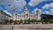 The Liverpool Museum and the Three Graces buildings as people stroll at the Liverpool waterfront