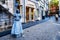 Living art statue of a girl in a grey dress in the center of the historic city of Maastricht