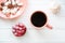 Living coral color cup and plate on white table