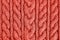 Living Coral knitted texture. Handmade Knitwear. Background. Color of the year 2019 concept