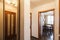 Living flat interior, hallway with open door