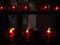 Living light candles in church