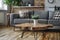 Living room with a couch, coffee table, and potted plant on hardwood flooring