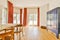 a living room with a dining room table and chairs