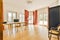 a living room and dining room with wood flooring