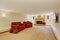 Living room with fireplace and red armchairs