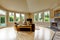 Living room with granite fireplace and high vaulted ceiling