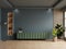 Living room with green cabinet for tv on dark blue color wall background