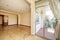 Living room of a house with access to a terrace with terracotta floors and aluminum and glass sliding doors