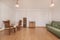 Living room of a house with a wooden dining table with a vinyl tablecloth