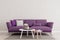 Living room interior wall mock up with purple violet sofa, empty white wall with free space above on top