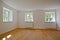 Living room in an old building - Apartment with wooden windows and parquet flooring after renovation