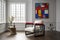 A living room with a Piet Mondrian-inspired armchair as the centerpiece. The armchair is geometric and colorful, with bold red, bl