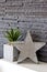 Living room wall design with modern slates texture and wooden star
