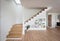 Living room with wooden stairway