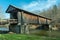 Livingston Manor, NY / United States - April 19, 2020: A three-quarter view of the Livingston Manor Covered Bridge spanning the