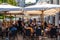 Ljubjana, Slovenia - 17 Aug, 2019 - People having lunch in packed restaurants during a hot day in the capital