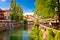 Ljubljana green riverfront promenade walkway summer view