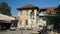 Ljubljana, Slovenia - 07/19/2015 - View of house in Metelkova in city center, artistic district with colored buildings, graffitti