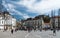 Ljubljana, Slovenia - People walking over the market square in old town near the three bridges