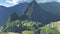 Llamas sitting on a terrace at machu picchu