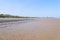 Llanbedrog beach, Wales, at low tide on a bright spring day