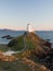 Llanddwyn lighthouse at sunset.