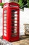 LLandudno, Wales, UK - MAY 27, 2018 An old classic British red phone booth. Traditional red phone box on street. Not working vinta