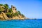 Lloret de Mar, Costa Brava. Landscape with sea, rocks and castle in sunny day, Catalonia, Spain