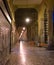 Lluminated cobbled street in Rome, Italy