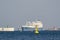 LNG TANKER AND YELLOW NAVIGATION SIGN