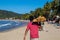 Lo de Marcos, Nayarit, Mexico - January 23, 2021: A man walks down the beach selling donuts