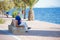 Lo PagÃ¡n, Murcia, Spain, June 22, 2020: Senior gentleman seated on a wooden bench watching Lo Pagan seascape in Murcia Spain,