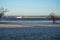 A loaded barge floats on a river in Europe