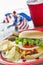 Loaded cheeseburger at a patriotic themed cookout