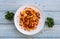 loaded Cheesy Fries Served in dish isolated on wooden table top view fastfood