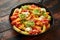 Loaded potato nachos with melted cheddar cheese, sour cream, tomato salsa, chilli, guacamole and beer