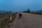 Loaded touring bike standing on a dirty road in fog in the Cambodian countryside