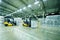 loader on the background of a huge industrial food warehouse with plastic PET bottles with beer, water, drinks.