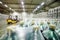 loader on the background of a huge industrial food warehouse with plastic PET bottles with beer, water, drinks.