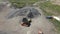 a loader loads crushed stone into a dump truck. aerial shooting