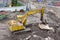 Loader small bulldozer moving breakstone at construction area. view from above