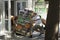 Loaders men pushing the cart fully laden with beer bottles packs into doors of a store