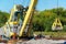 Loading barge with sand and rubble on a small berth. Freight transport logistics.