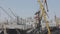 Loading bulk materials into the ship, loading the cargo ship with cranes in the port. Cargo ships in port loading them