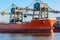 Loading of cargo ship in North Sea port of Ghent, Belgium