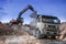 Loading a large lorry building material clay pit